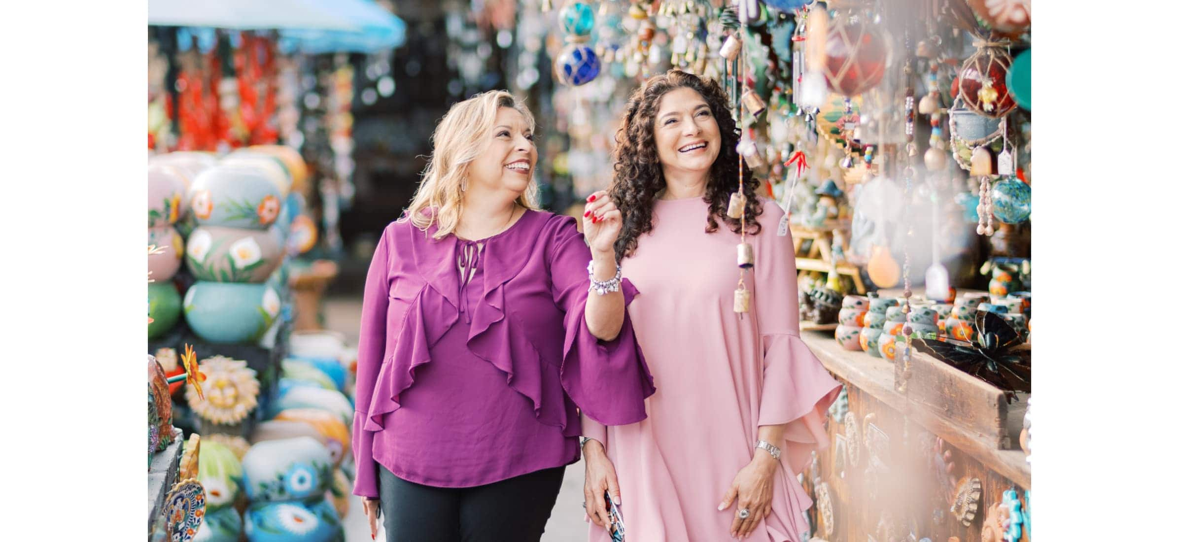 Nury walks with a client through the outdoor markets of San Diego. 